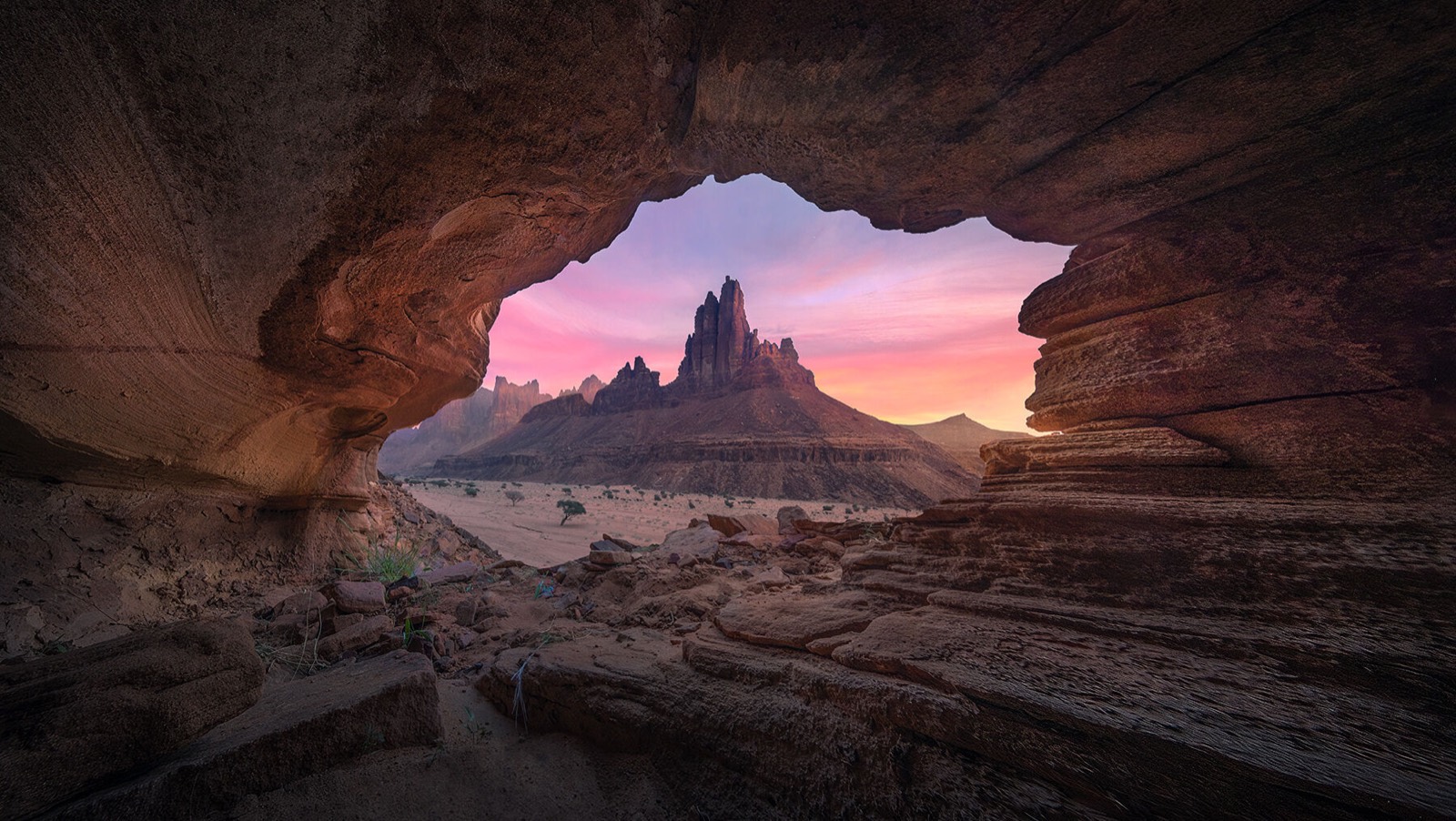 Desert rock spires seen from a cave